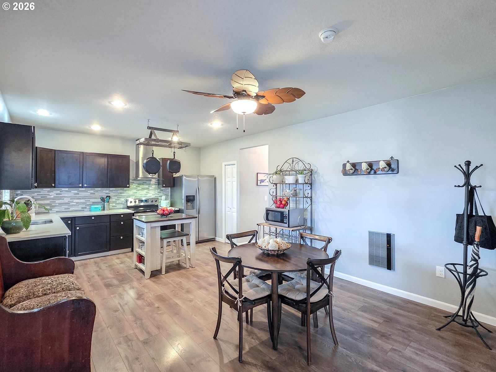1214 North Clark Street Cornelius, OR 97113 - Photo 11 of 34 a view of a dining room with furniture and wooden floor