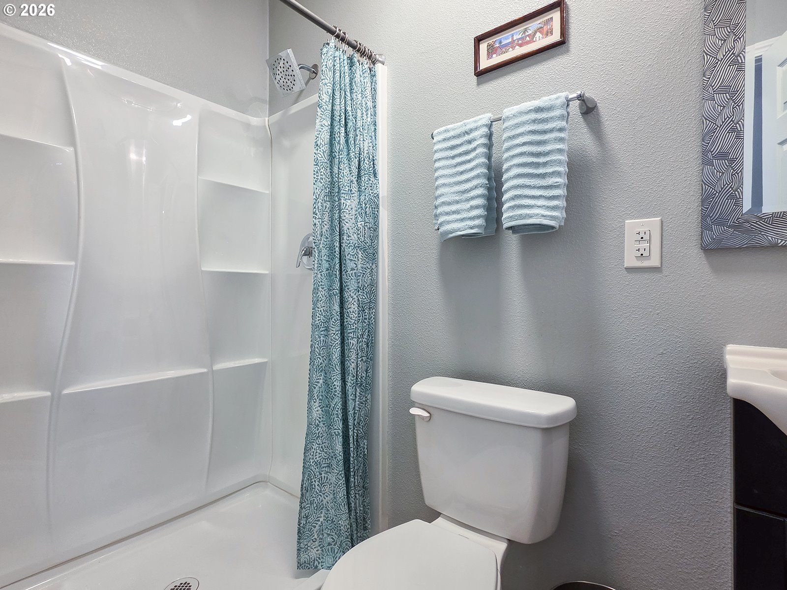 1214 North Clark Street Cornelius, OR 97113 - Photo 15 of 34 a white toilet sitting next to a bathroom sink