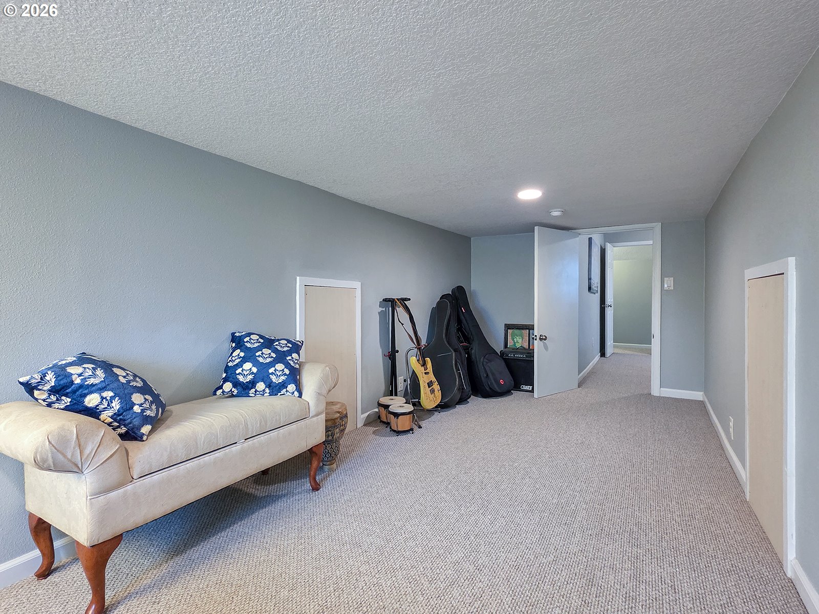 1214 North Clark Street Cornelius, OR 97113 - Photo 28 of 34 a living room with furniture gym equipment and a chandelier
