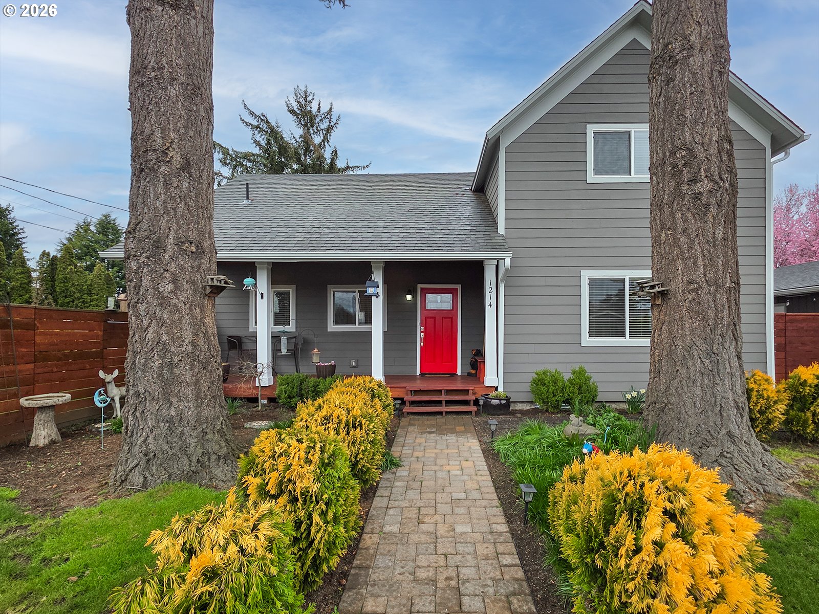 1214 North Clark Street Cornelius, OR 97113 - Photo 6 of 34 a front view of a house with garden