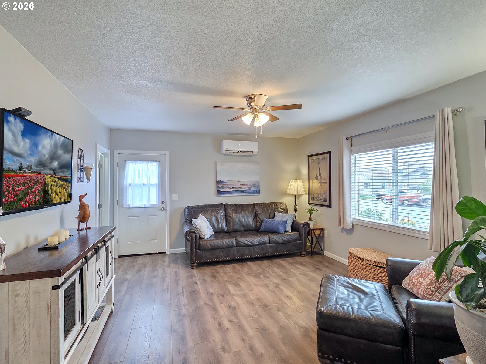 1214 North Clark Street Cornelius, OR 97113 - Photo 8 of 34 a living room with furniture and a flat screen tv