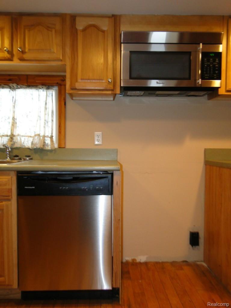 1064 Angle Road Lapeer, MI 48446 - Photo 15 of 28 New Stainless Steel Dishwasher and Microwave