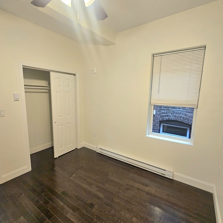 49 Charter Street, Unit 3 Boston, MA 02113 - Photo 8 of 10 an empty room with wooden floor and a window