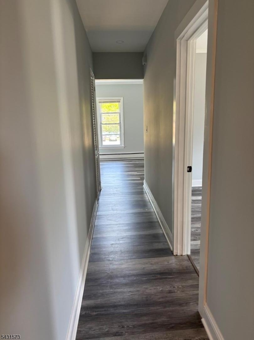 358 Woodland Road, Unit 2 Madison, NJ 07940 - Photo 37 of 50 a view of a hallway with wooden floor and a bathroom