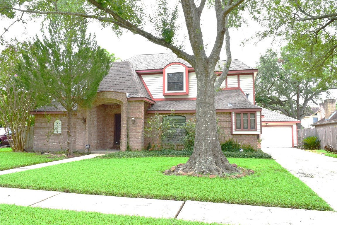7331 Rancho Mission Drive Houston, TX 77083 - Photo 2 of 24 Front with long driveway to the detached garage