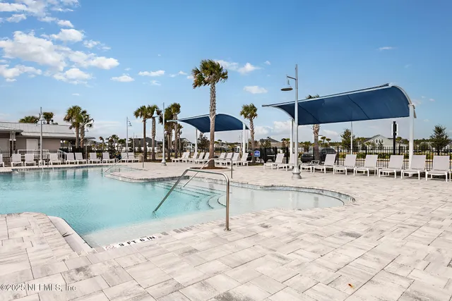 a kitchen with a table and chairs