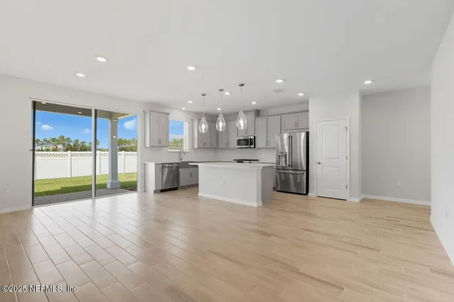 a view of kitchen with wooden floor