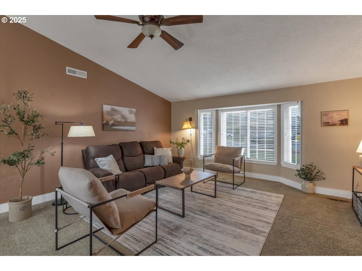 1393 Southwest Alexander Drive Dallas, OR 97338 - Photo 12 of 47 a living room with furniture and a window