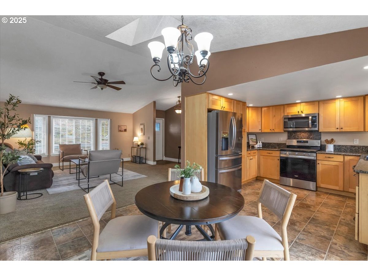 1393 Southwest Alexander Drive Dallas, OR 97338 - Photo 15 of 47 a view of a dining room with furniture