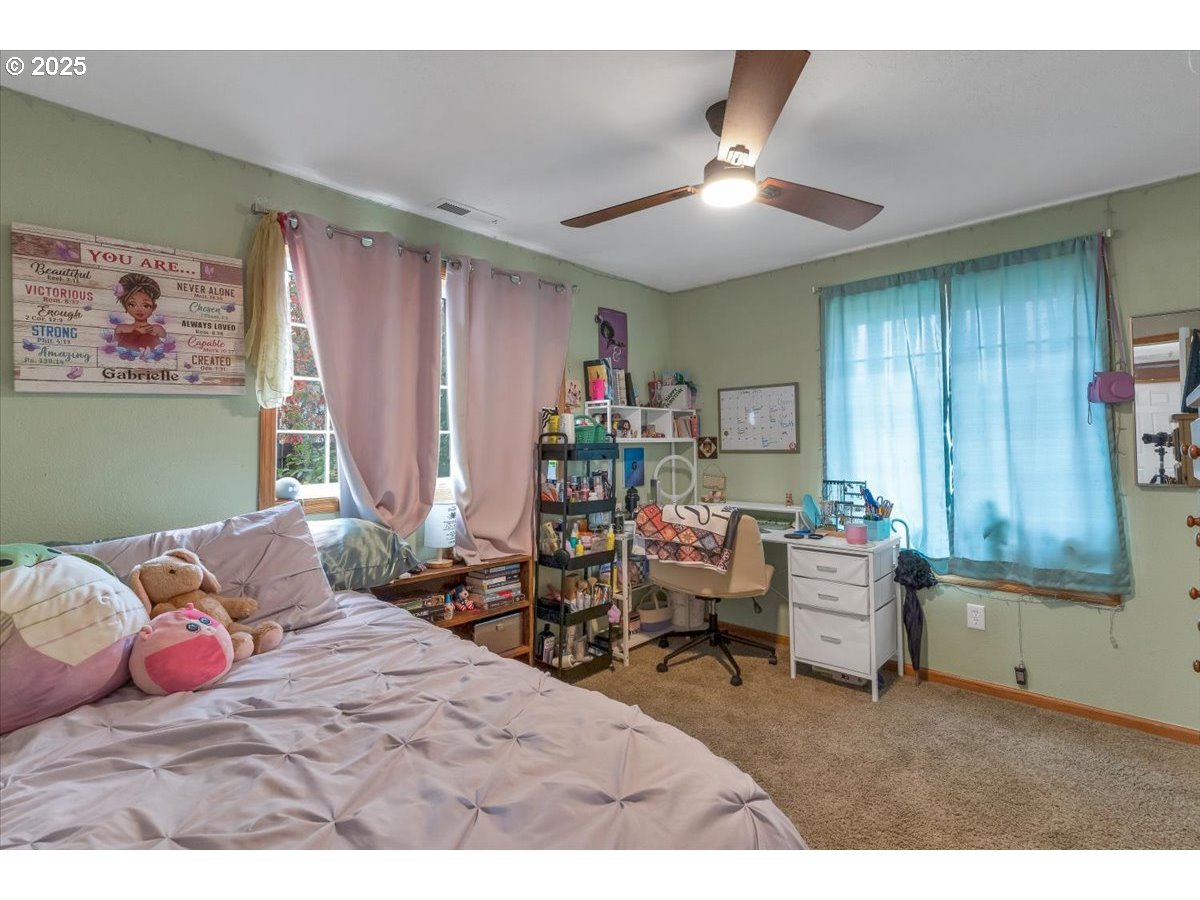 1393 Southwest Alexander Drive Dallas, OR 97338 - Photo 26 of 47 a bedroom with furniture and a large window