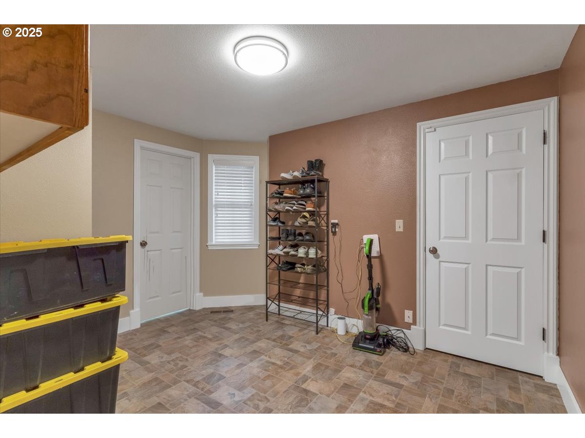 1393 Southwest Alexander Drive Dallas, OR 97338 - Photo 31 of 47 a view of an empty room with a fireplace