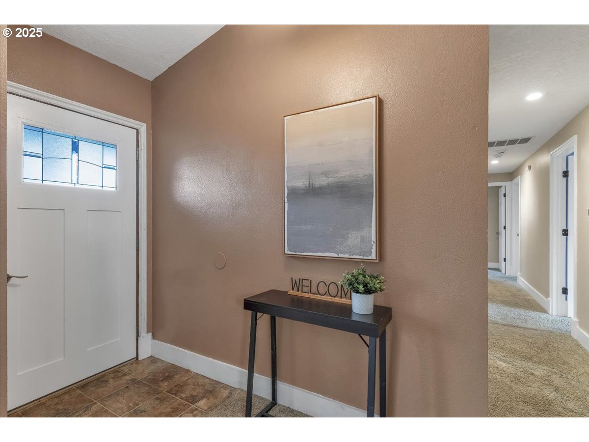 1393 Southwest Alexander Drive Dallas, OR 97338 - Photo 40 of 47 a bathroom with a sink a mirror and a window