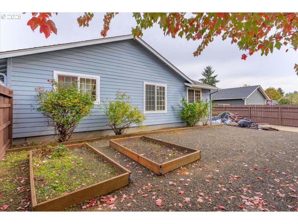 1393 Southwest Alexander Drive Dallas, OR 97338 - Photo 45 of 47 a view of a backyard with plants and a patio