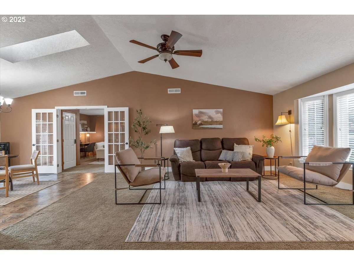 1393 Southwest Alexander Drive Dallas, OR 97338 - Photo 8 of 47 a living room with furniture and wooden floor