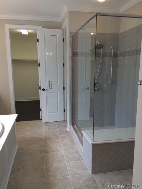 689 Chase Court, Unit 118 Fort Mill, SC 29708 - Photo 8 of 12 a bathroom with a sink and mirror