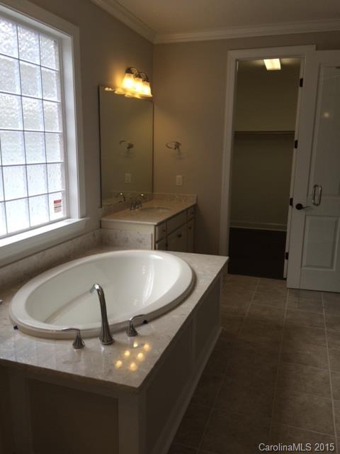 689 Chase Court, Unit 118 Fort Mill, SC 29708 - Photo 9 of 12 a view of staircase with a washer and dryer