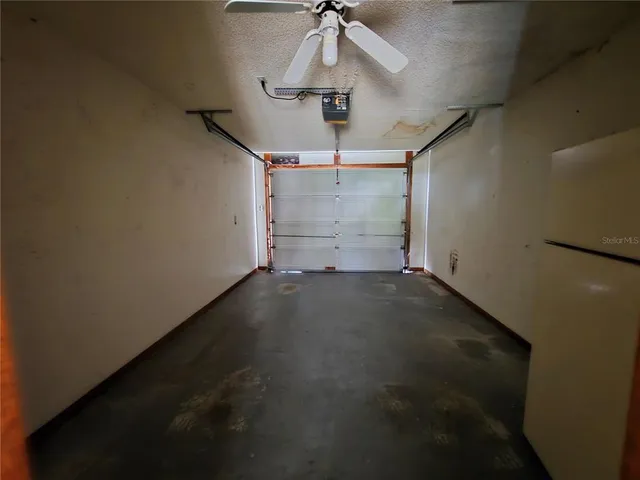 a kitchen with a stove sink and cabinets