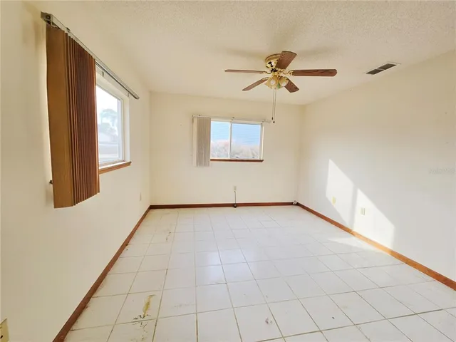 a kitchen with a sink a stove top oven and cabinets