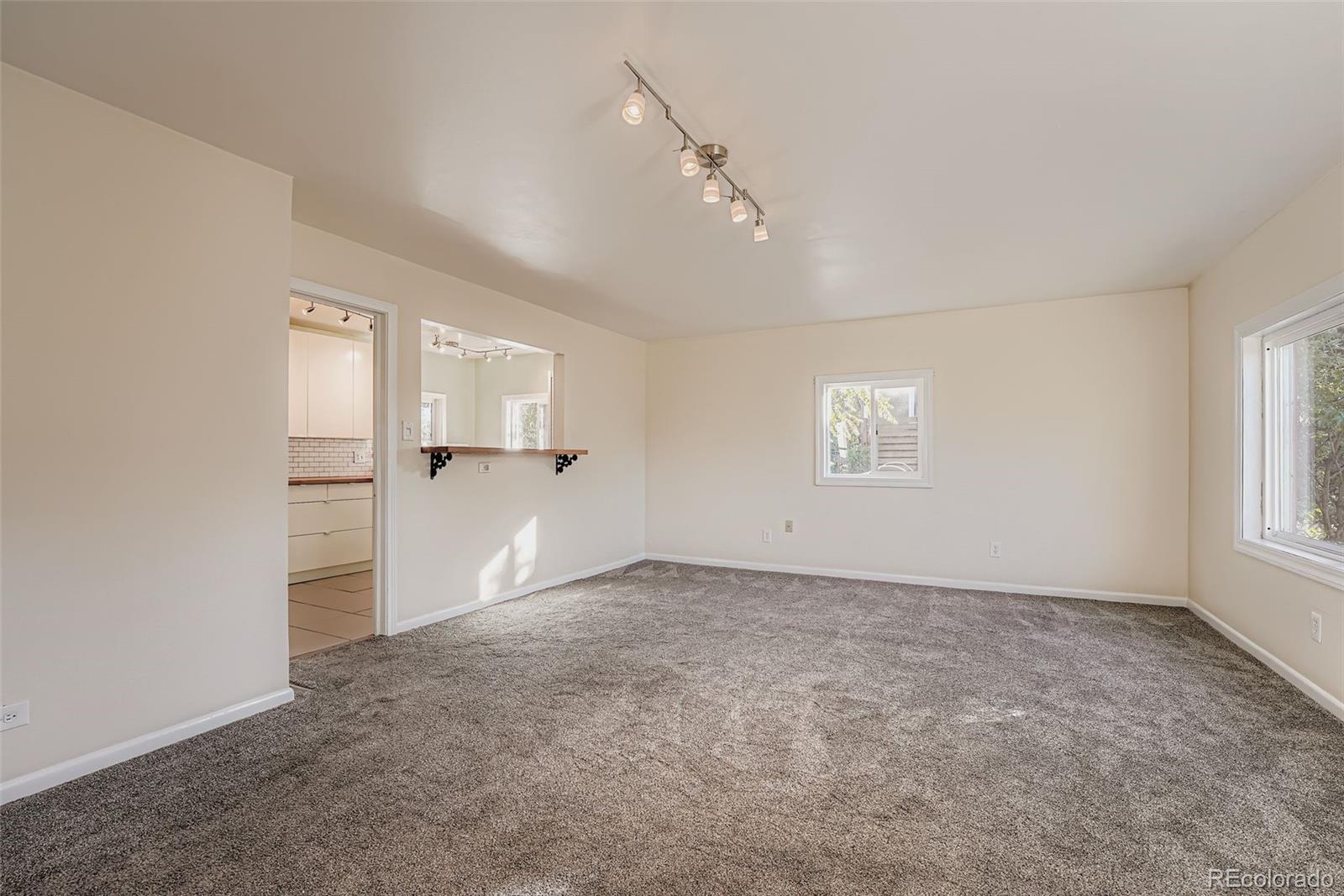 3630 Fillmore Street Denver, CO 80205 - Photo 11 of 50 wooden floor in an empty room with a window