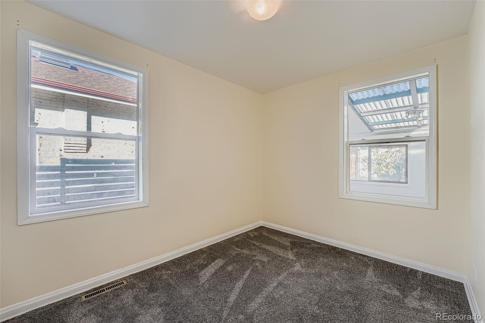 3630 Fillmore Street Denver, CO 80205 - Photo 12 of 50 a view of an empty room with a window