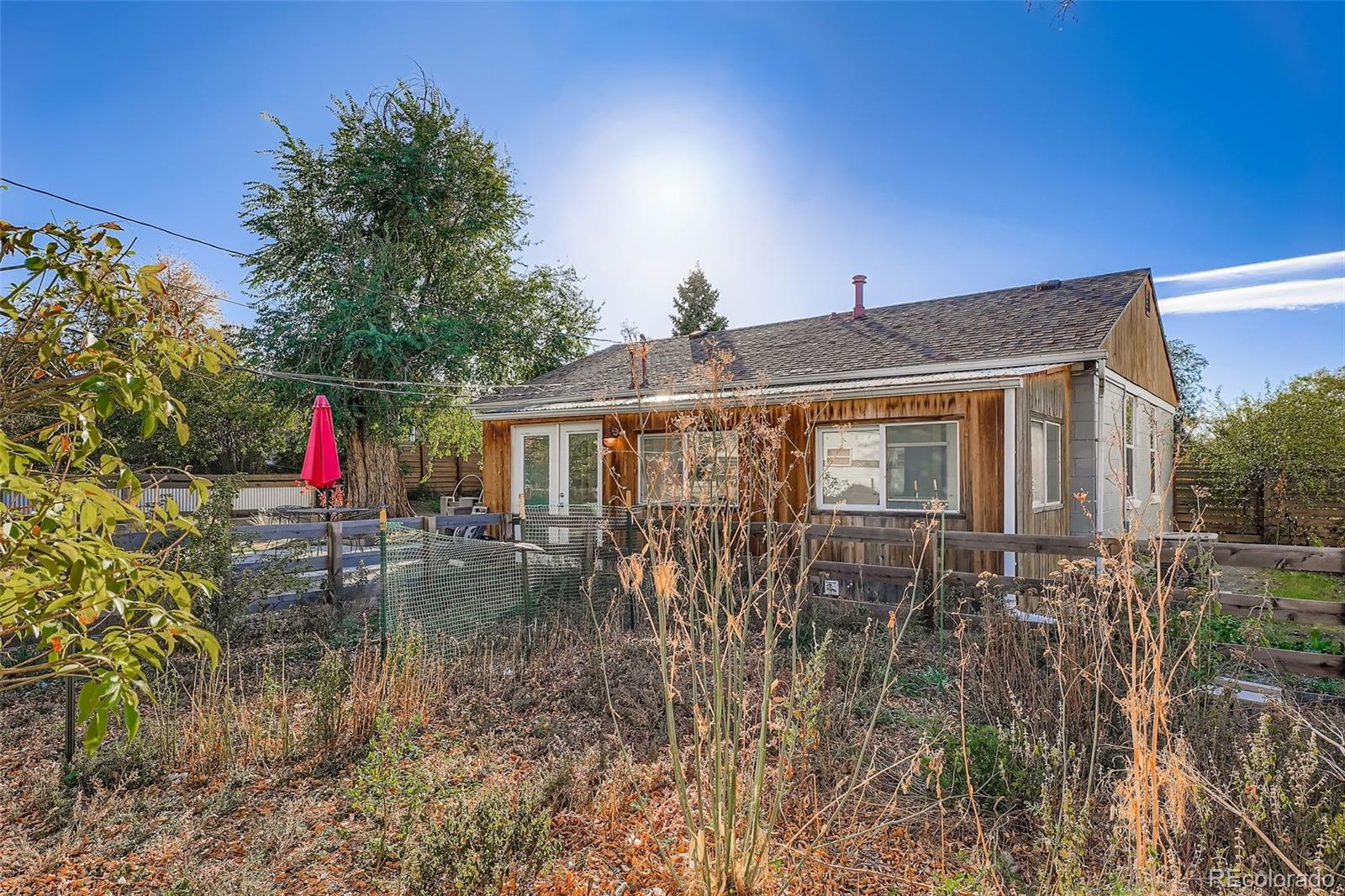 3630 Fillmore Street Denver, CO 80205 - Photo 28 of 50 a backyard of a house with table and chairs