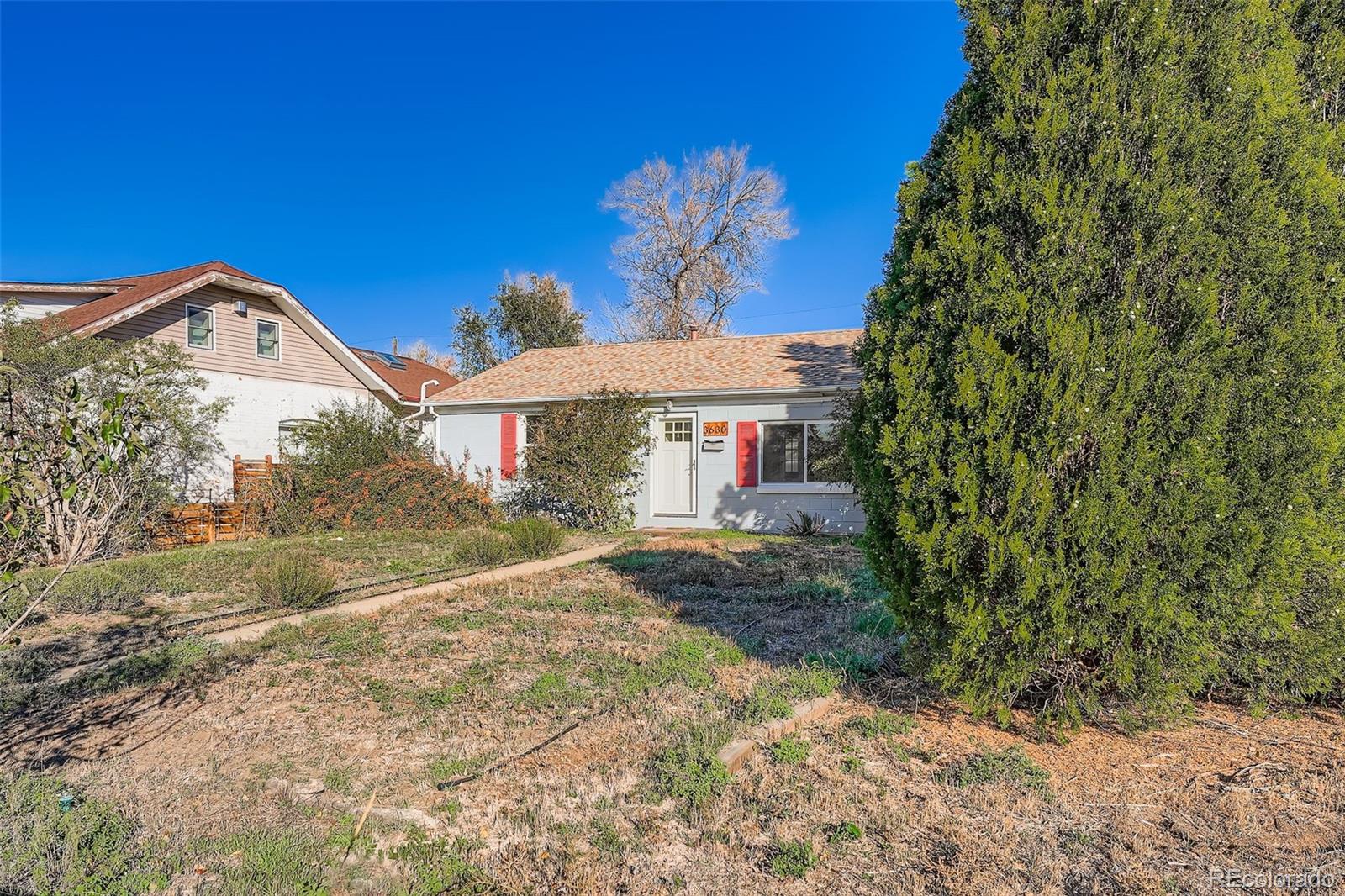 3630 Fillmore Street Denver, CO 80205 - Photo 29 of 50 a front view of a house with a yard