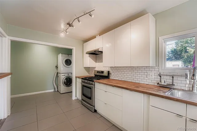 a kitchen with a stove and a sink