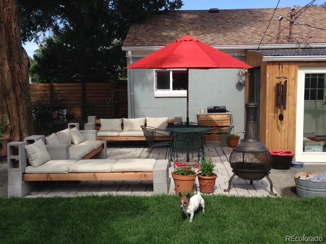 3630 Fillmore Street Denver, CO 80205 - Photo 50 of 50 a patio with couches and a fire pit and chairs