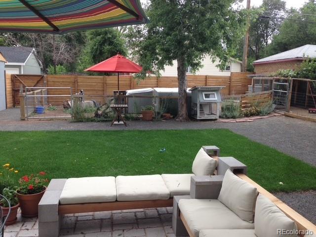 3630 Fillmore Street Denver, CO 80205 - Photo 5 of 50 a view of a house with backyard sitting area and garden