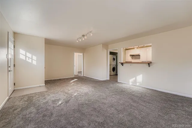 an empty room with windows and pillars in it