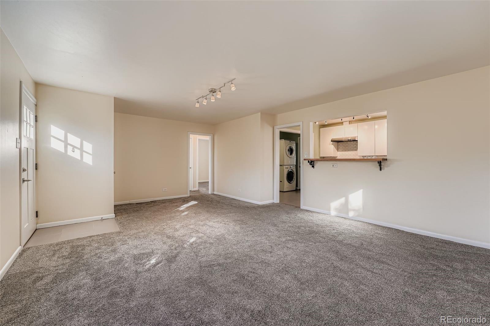 3630 Fillmore Street Denver, CO 80205 - Photo 7 of 50 an empty room with windows and pillars in it