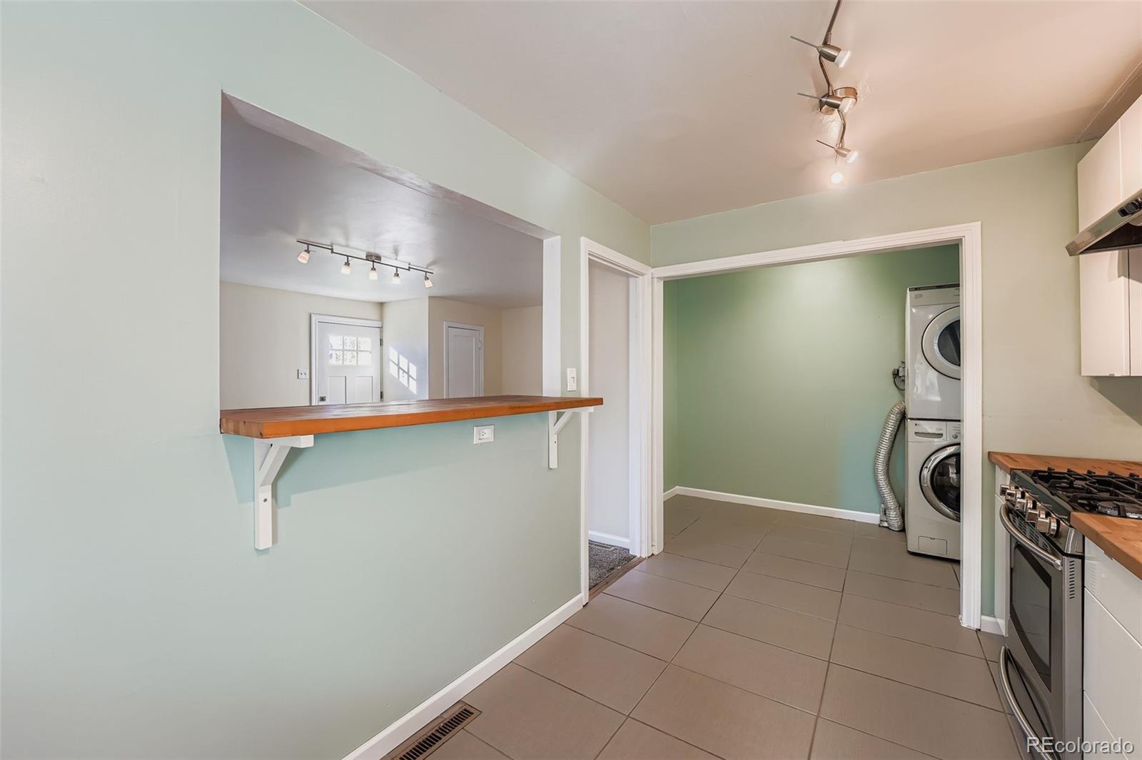 3630 Fillmore Street Denver, CO 80205 - Photo 8 of 50 a view of a livingroom with a staircase