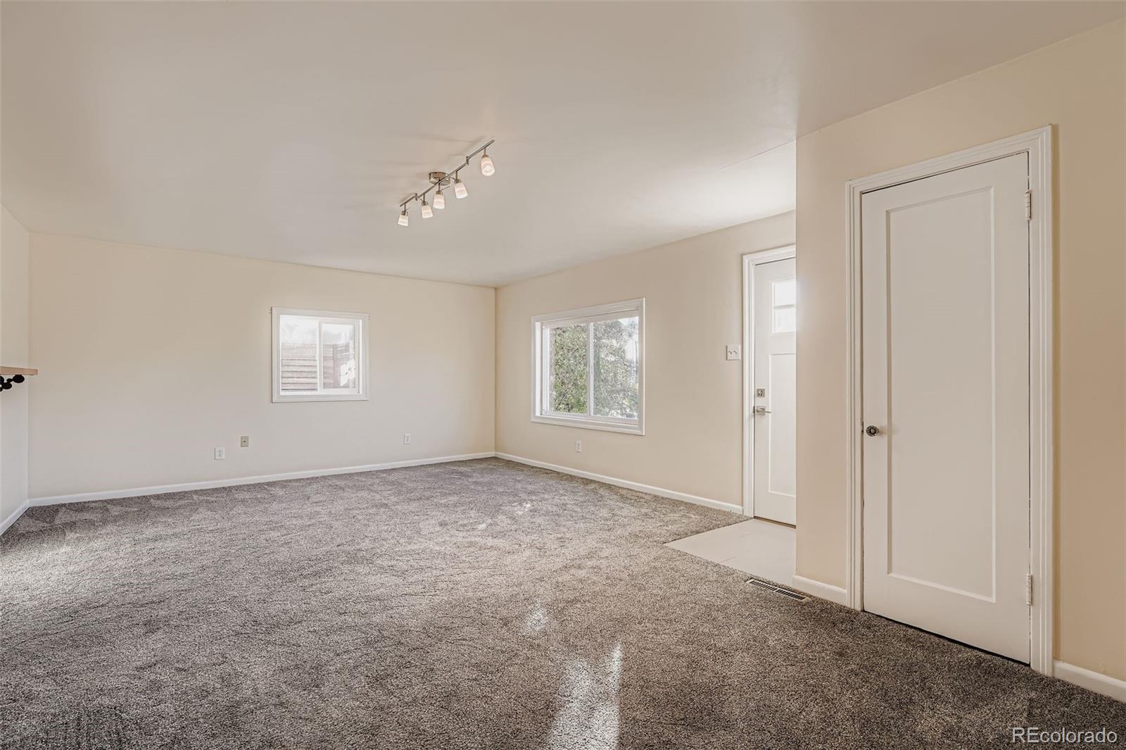 3630 Fillmore Street Denver, CO 80205 - Photo 10 of 50 an empty room with windows and closet