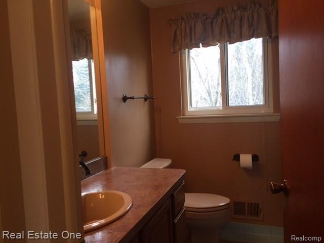 30072 Merrick Warren, MI 48092 - Photo 23 of 27 Upper bathroom, newer cabinets and hardware Beige not pink