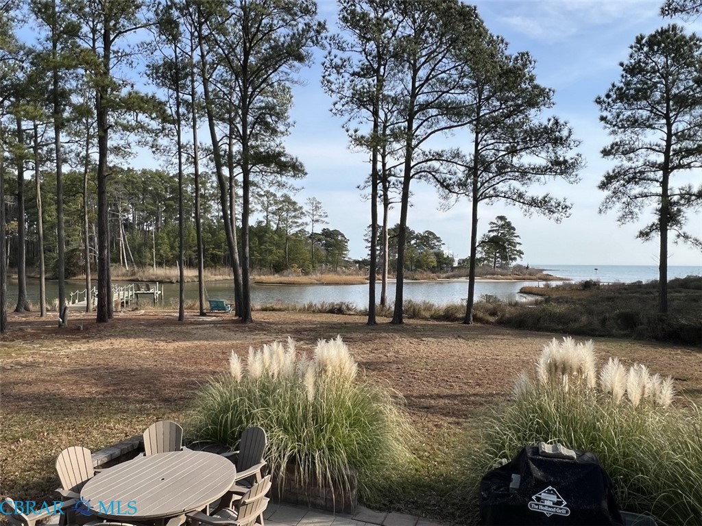 301 Gillim Road Deltaville, VA 23043 - Photo 30 of 31 View of yard with a water view and a patio area