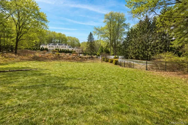 a view of a yard with swimming pool