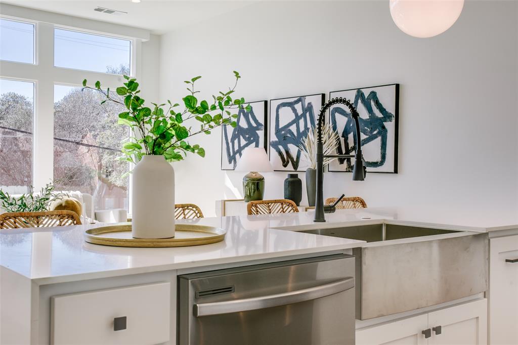 6039 Lewis Street Dallas, TX 75206 - Photo 1 of 1 a vase of flowers sitting on a table