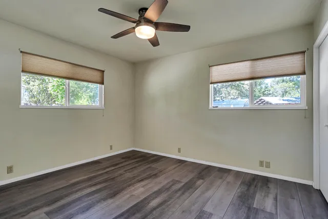 a kitchen with a sink cabinets and window