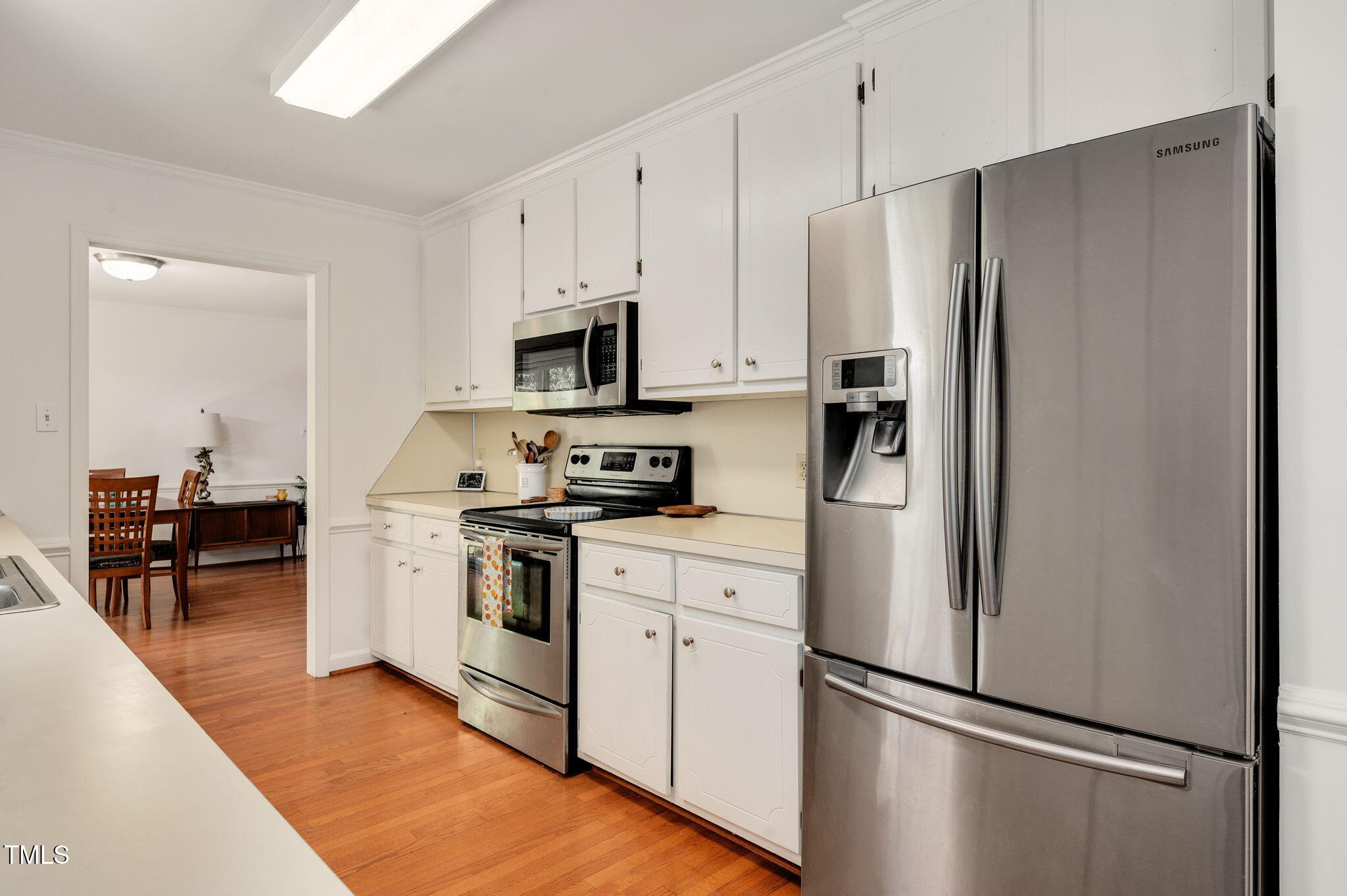 5320 Middleton Road Durham, NC 27713 - Photo 13 of 36 a kitchen with stainless steel appliances a refrigerator sink and microwave