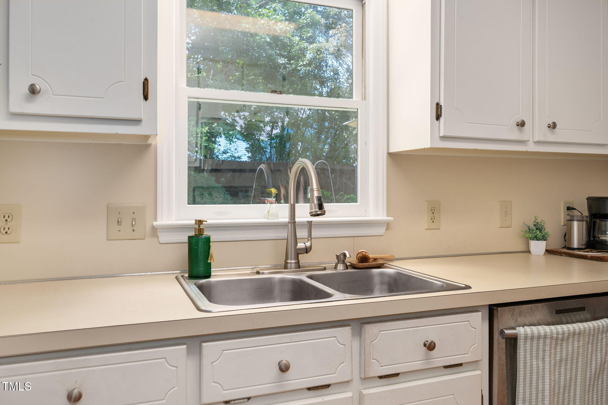 5320 Middleton Road Durham, NC 27713 - Photo 14 of 36 a kitchen with a sink and cabinets