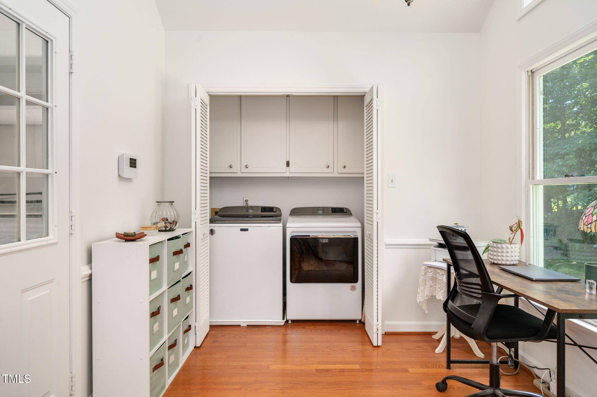 5320 Middleton Road Durham, NC 27713 - Photo 17 of 36 a kitchen with stainless steel appliances white cabinets and wooden floor