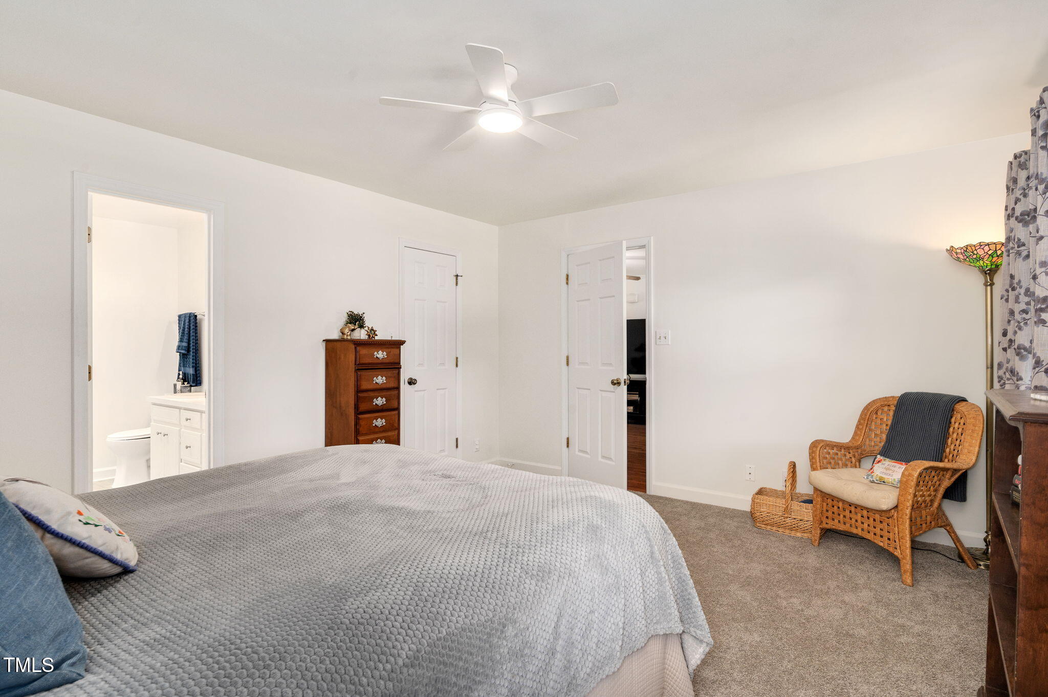 5320 Middleton Road Durham, NC 27713 - Photo 19 of 36 a bedroom with a bed and a chair