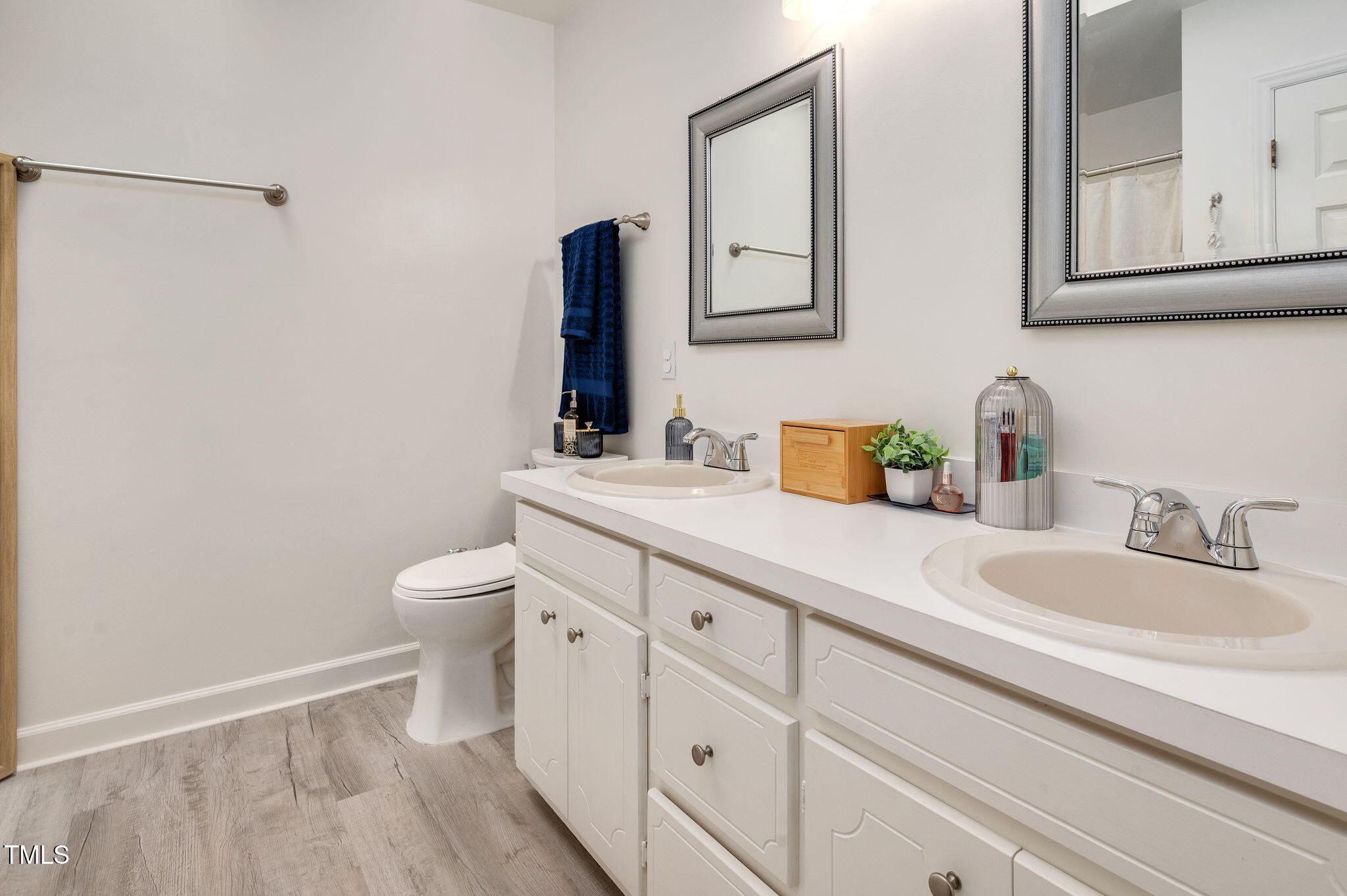 5320 Middleton Road Durham, NC 27713 - Photo 22 of 36 a bathroom with a sink a toilet and vanity