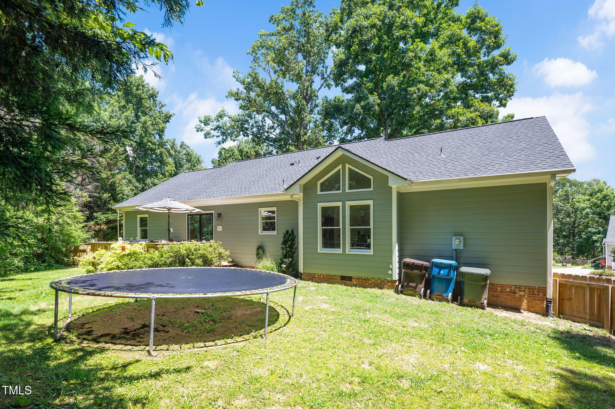 5320 Middleton Road Durham, NC 27713 - Photo 30 of 36 a view of a chair and table in the backyard of the house