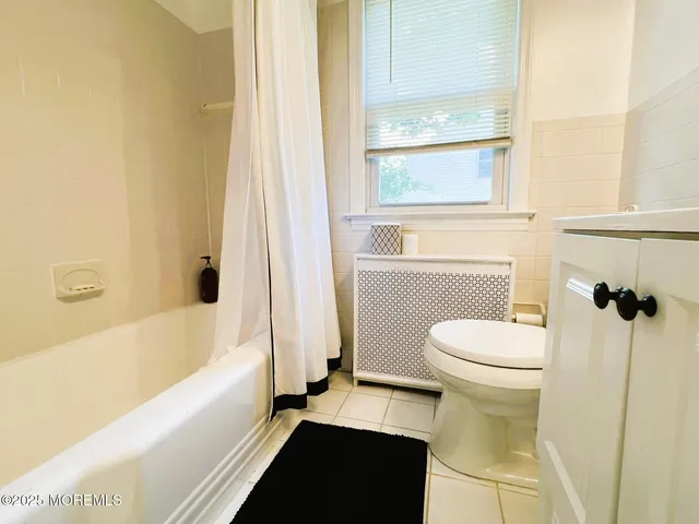 a bathroom with a toilet a sink and a bathtub