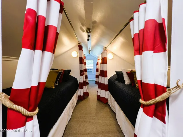 a living room with chairs and furniture