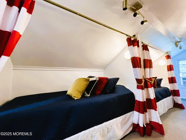 a living room with a bed and a couch