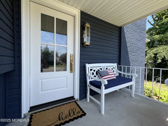 a view of a two chairs in the balcony