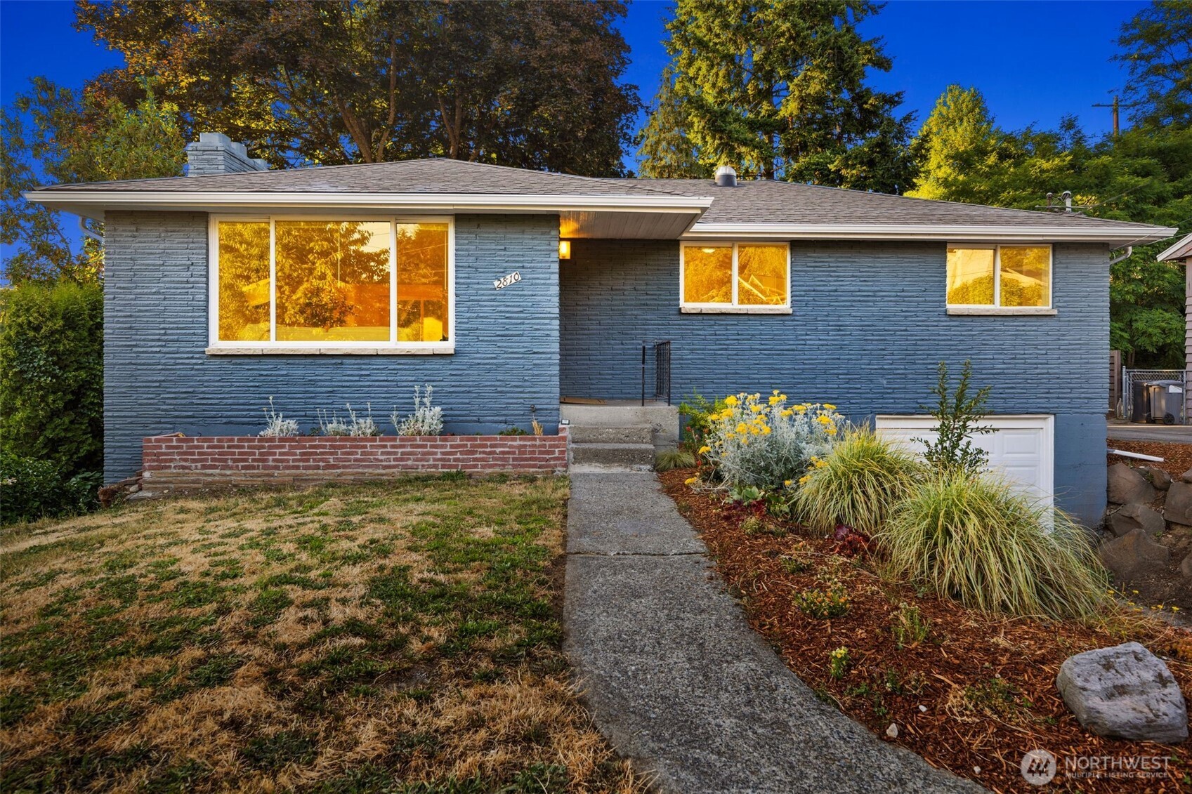 2810 Southwest 112th Street Seattle, WA 98146 - Photo 3 of 21 a view of a brick house with a yard