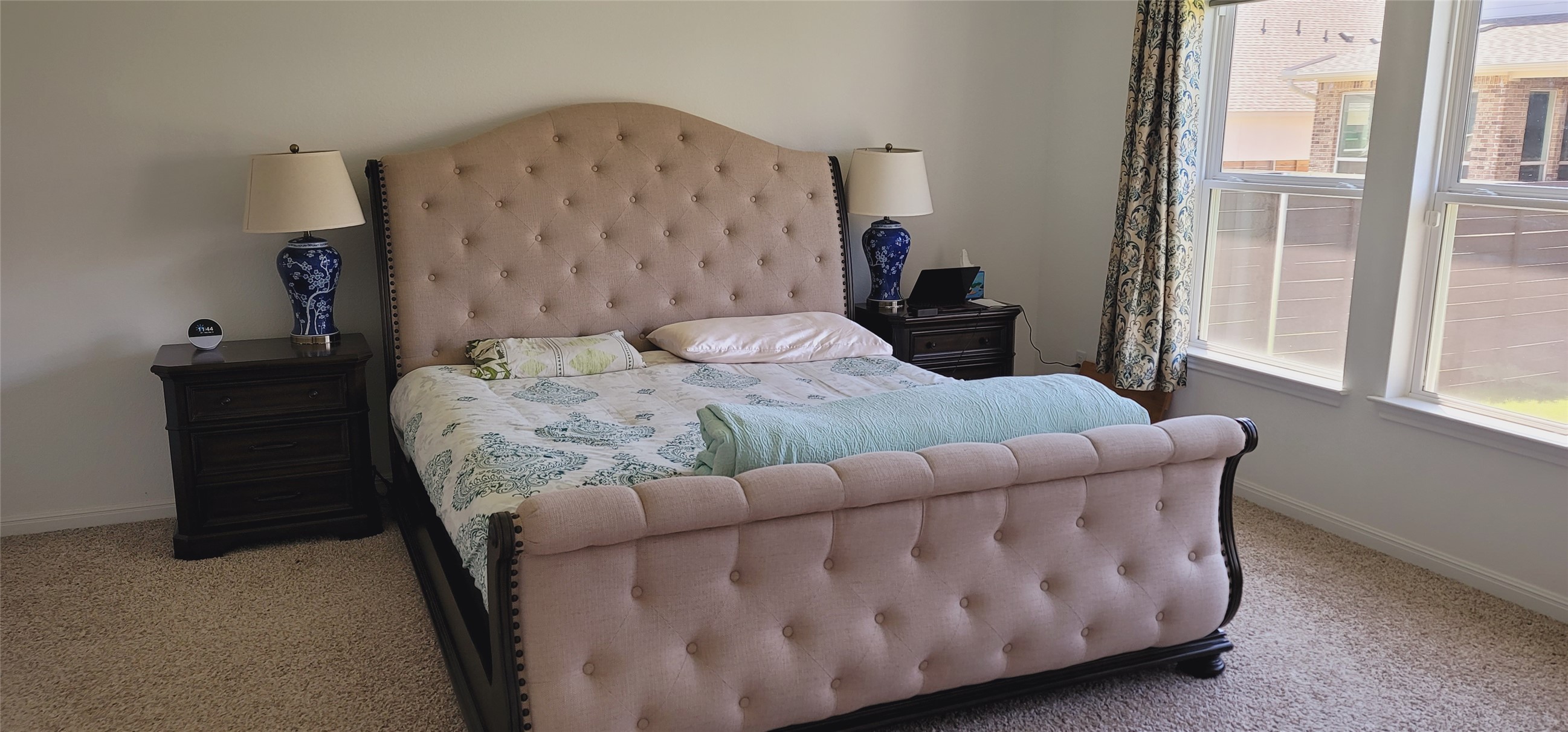 716 Leeward Pass Leander, TX 78641 - Photo 12 of 26 Plush carpet and ample natural light enhance the serenity of this primary bedroom.